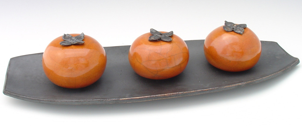 Persimmons On A Tray