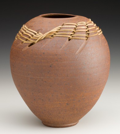 stoneware vessel with rattan